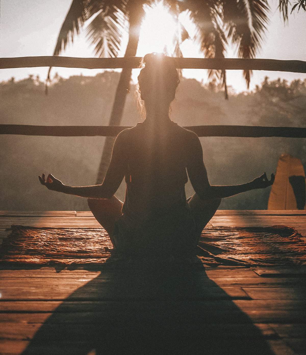 Person seated in meditation at sunrise, evoking the nervous-system regulation work at the core of the anger management intensive